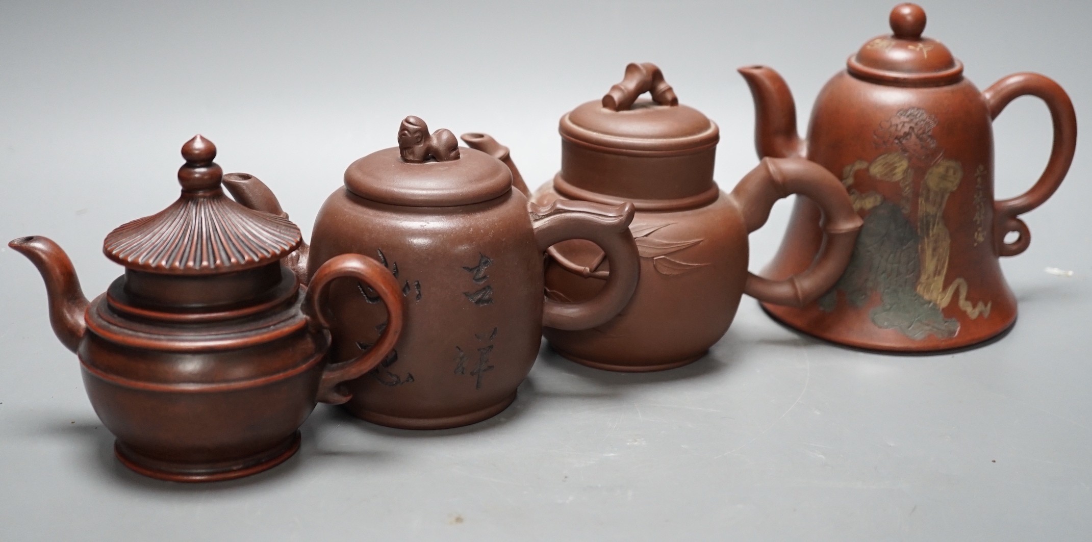 Four Chinese Yixing teapots, tallest 13cm